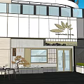 Modern Storefront Design With White Facade Gold Lotus Logo Glass Door Entrance And Outdoor Seating