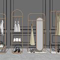 Modern Golden Metal Clothes Racks for Retail Display with Hanging Dresses Mirrors and Accessories
