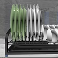 Kitchen Cabinets With Dish Rack Featuring Green White Plates And Wooden Spoons On Marble Countertop