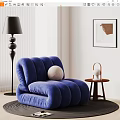 Blue Plush Single Sofa With Curved Design Black Floor Lamp Side Table And Wall Art