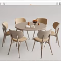 Round Dining Table Set with Six Light Wood Chairs Beige Cushions Fruit Bowl and Book