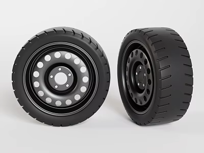 Two black tires displayed side by side with rims featuring holes on surface 3d model