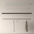 Hanging Clothes Racks Mounted on Wall With White And Gray Clothes And Small Decorative Item