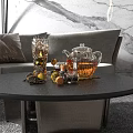 Refreshing Iced Tea in Glass Teapot on Living Room Coffee Table with Lemon Slices and Ice