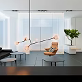 Modern Hotel Lobby Lounge With Black Sofa And Hanging Lamp