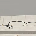 Three Modern Circular Chandeliers With Metal Frame Hanging In Minimalist Room