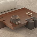 Modern Layered Coffee Table With Stack Of Books Metallic Bowl And Decor In Living Room