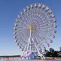 Scenic Amusement Park Ferris Wheel With Colorful Ground And Water Area