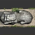 Ancient Stone Lion Statue With Detailed Carving And Moss On Base
