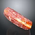 Appetizing Cured Salami Slice with Red and White Marbled Texture and Glistening Surface