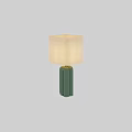 Green Cylindrical Ceramic Table Lamp With Beige Fabric Shade And Soft Light