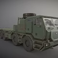 Green Military Truck with Flatbed Trailer Spare Tire on Top and Multiple Large Wheels