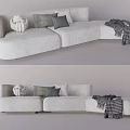 White Upholstered Sectional Sofa With Decorative Pillows And Plaid Blanket 3d model