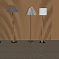 Modern Floor Lamps With Various Designs Against Wooden Panel Wall And Natural Light