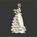 Porcelain Woman Figurine in Elegant White Ruffled Dress with Red Hair on Shiny Black Surface