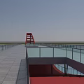 Modern Landscape Bridge With Red Arch Structure Spanning Water And Riverbank Pavement