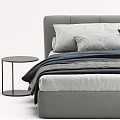 Gray Double Bed With Gray White Navy Blue Bedding And Small Round Side Table 3d model