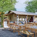 Courtyard Garden Featuring Bamboo Furniture Swing Chair Cottage Trees And Decorative Plates