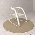 Minimalist White Accent Chair With Curved Armrests And Metal Frame On Round Brown Rug