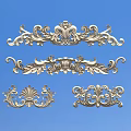 Decorative Metal Carvings With Intricate Scroll Patterns And Ornate Design Elements