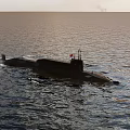 Military Submarine Vessel Navigating Open Ocean Waters With Command Tower And Calm Surface