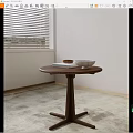 Modern Wooden Round Side Table With Cross Base Featuring Books And Bowls
