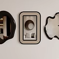 Three Decorative Wall Mirrors With Various Shapes Mounted On White Wall 3d model