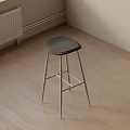Modern Bar Stool With Black Seat And Metal Legs On Wooden Floor