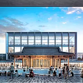 Modern School Building With Glass Facade Traditional Roof And Open Plaza For People Gathering