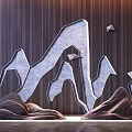 Decorative Ornament Set Featuring Grey Geometric Mountain Shapes and Brown Rock-like Ornaments on Wooden Wall