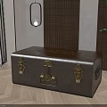 Brown Leather Trunk With Golden Clasps And Bamboo Screen In Interior Decor