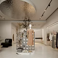 Minimalist Clothing Store Interior With Silver Circular Ceiling Mannequin Clothes On Racks Plants And Sofa