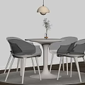 Modern Round Negotiation Table With Four Light Colored Chairs Hanging Lamp And Green Plant