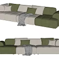 Modern Sectional Sofa with Green and Beige Plush Cushions and Cozy Throw Blanket