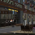 Commercial Street With Starbucks Coffee Shop Outdoor Seating Evening Lights Storefronts Tables Chairs And Flower Pots