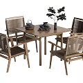 Stylish Wooden Dining Table Set With Rattan Chairs Teapot Cups And Potted Plant