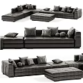 Beige Fabric Double Sofa With Checkered Pillows Cozy Throw Blanket And Ottoman