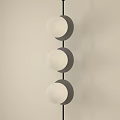 Modern Decorative Light With Three Round Globes And Black Hanging Frame In Minimalist Room
