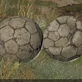 Two Vintage Textured Soccer Balls Lying On Natural Grass Field Outdoor