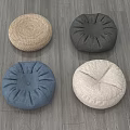 Four Round Decorative Floor Cushions In Woven And Fabric Materials With Assorted Colors