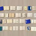Old Books Neatly Arranged on Wooden Background with Multiple Open Pages and Blue Cover Books
