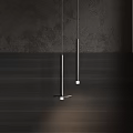 Modern Slim Pendant Lights Hanging Over Dark Textured Wall And Wooden Surface