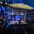 Vibrant Live Music Festival Stage With Bright Lights And Audience Light Sticks