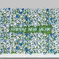 Floral Installation For New Year With Blue Purple White Flowers And Happy New Year Text