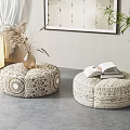 Round Decorative Floor Cushions with Intricate Patterns and Open Book on Top in Living Space