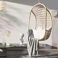 Rattan Hanging Chair in Modern Living Room With White Cushion Gray Blanket and Pendant Lights
