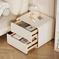 White Nightstand with Open Drawers Holding Magazines Books Topped with Lamp Decor