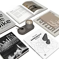 Stylish Modern Books And Magazines Collection With Open Book Coffee Cup And Decorative Cones