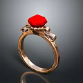 Elegant Gold Ring With Red Gemstone And Decorative Metal Details