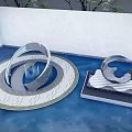 Modern Style Metal Circular Design Landscape Sculptures in Pool with Green Trees and Blue Sky